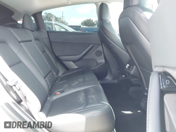 2020 Tesla Model Y Long Range with VIN 5YJYGDEE2LF058515, listed as a IAAI auction lot 41932748 with 62,885 mi miles and . Bid and sale history available at DreamBid. Image 8.