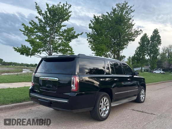 2015 GMC Yukon XL Denali with VIN 1GKS1JKJ0FR246265, listed as a Copart auction lot 54958185 with 157,545 mi miles and Clean Title. Bid and sale history available at carsss.com. Image 4.