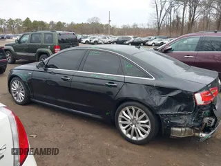 2015 Audi A6 Premium Plus z VIN WAUFGAFC6FN043800, wystawiony jako IAAI lot #41702164 z przebiegiem 122 267 mil mil oraz . Historia ofert i sprzedaży dostępna na DreamBid. Obrazek 14.