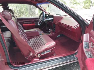 1990 Cadillac Eldorado z VIN 1G6EL1333LU608572, wystawiony jako IAAI lot #42191060 z przebiegiem 105 433 mil mil oraz . Historia ofert i sprzedaży dostępna na DreamBid. Obrazek 5.