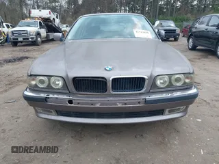 1998 BMW 7 Series 740il with VIN WBAGJ8323WDM23239, listed as a IAAI auction lot 41512630 with 221,673 mi miles. Bid and sale history available at carsss.com. Image 13.