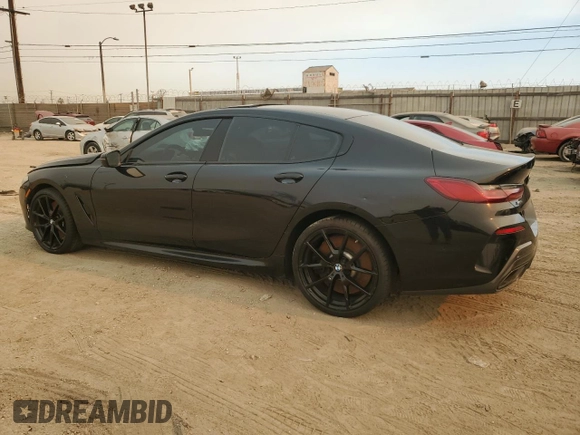 2022 BMW 8 Series M850i with VIN WBAGV8C02NCK08667, listed as a Copart auction lot 88255605 with 22,737 mi miles and Salvage title. Bid and sale history available at DreamBid. Image 2.