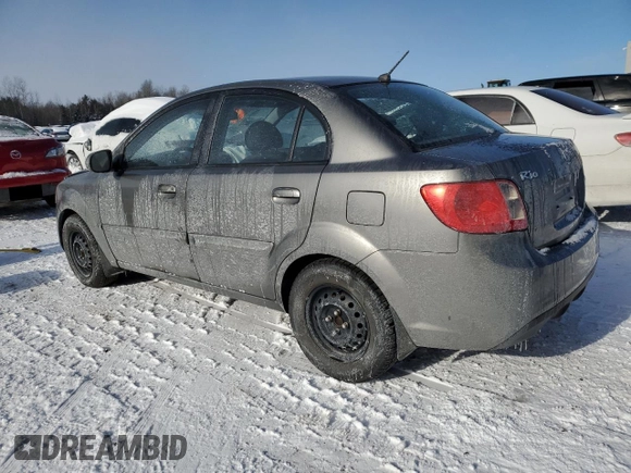 2011 Kia Rio with VIN KNADH4B32B6915325, listed as a Copart auction lot 86824074 with 167,410 mi miles and Salvage Title. Bid and sale history available at DreamBid. Image 2.