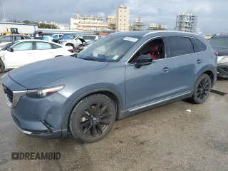 2021 Mazda CX-9 Grand Touring z VIN JM3TCADYXM0519757, wystawiony jako Copart lot #86665134 z przebiegiem 51 217 mil mil oraz Szkoda całkowita • Salvage title. Historia ofert i sprzedaży dostępna na DreamBid. Obrazek 1.