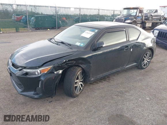 2015 Scion tC with VIN JTKJF5C7XFJ001662, listed as a IAAI auction lot 41843123 with 128,851 mi miles. Bid and sale history available at carsss.com. Image 17.