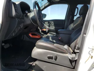 2023 Nissan Frontier SV with VIN 1N6ED1EJ3PN670640, listed as a Copart auction lot 58039525 with 15,302 mi miles and Salvage title. Bid and sale history available at DreamBid. Image 7.