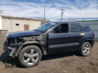 2013 Jeep Grand Cherokee Overland with VIN 1C4RJFCT2DC576125, listed as a Copart auction lot 52595165 with 100,361 mi miles and Salvage Title. Bid and sale history available at carsss.com. Image 1.