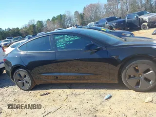 2023 Tesla Model 3 Long Range with VIN 5YJ3E1EB6PF634116, listed as a IAAI auction lot 41814670 with 47,801 mi miles and . Bid and sale history available at DreamBid. Image 14.