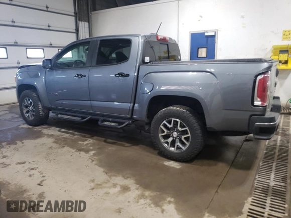 2021 GMC Canyon 4WD AT4 z VIN 1GTG6FEN1M1203936, wystawiony jako Copart lot #56041315 z przebiegiem 54 939 mil mil oraz Szkoda całkowita • Salvage title. Historia ofert i sprzedaży dostępna na DreamBid. Obrazek 2.