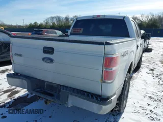 2014 Ford F-150 XL with VIN 1FTFW1EF5EFA45595, listed as a IAAI auction lot 41535410 with 124,208 mi miles. Bid and sale history available at carsss.com. Image 4.
