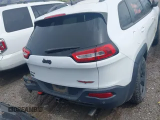 2018 Jeep Cherokee Trailhawk with VIN 1C4PJMBX3JD548761, listed as a IAAI auction lot 42107376 with 148,525 mi miles and . Bid and sale history available at DreamBid. Image 15.