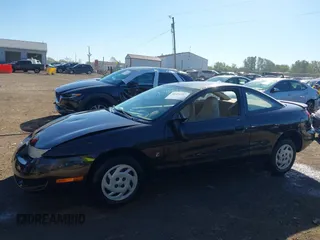 1997 Saturn SC z VIN 1G8ZE1283VZ163658, wystawiony jako IAAI lot #40494467 z przebiegiem 111 701 mil mil oraz . Historia ofert i sprzedaży dostępna na DreamBid. Obrazek 14.