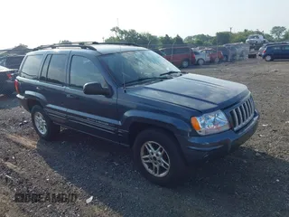 2004 Jeep Grand Cherokee Laredo z VIN 1J4GW48S14C223205, wystawiony jako IAAI lot #42797308 z przebiegiem 200 294 mil mil oraz . Historia ofert i sprzedaży dostępna na DreamBid. Obrazek 1.