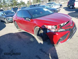 2022 Toyota Camry Hybrid XSE z VIN 4T1K31AK6NU034493, wystawiony jako IAAI lot #41682129 z przebiegiem 31 604 mil mil oraz . Historia ofert i sprzedaży dostępna na DreamBid. Obrazek 1.