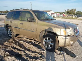 2006 GMC Envoy SLT with VIN 1GKDS13S662236037, listed as a IAAI auction lot 41418942 with 1 mi miles. Bid and sale history available at carsss.com. Image 1.