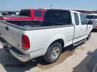 2003 Ford F-150 XL with VIN 1FTRX17243KA96403, listed as a IAAI auction lot 42017173 with 195,120 mi miles. Bid and sale history available at carsss.com. Image 4.