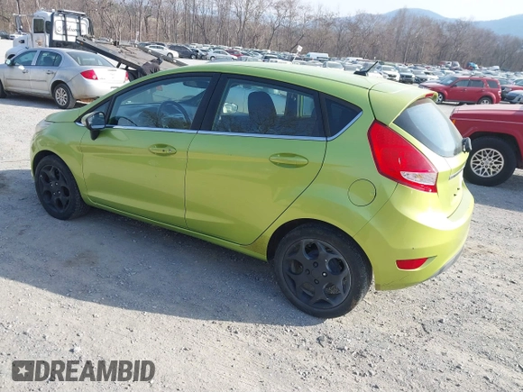 2011 Ford Fiesta SES with VIN 3FADP4FJ4BM108857, listed as a IAAI auction lot 41848272 with 138,943 mi miles. Bid and sale history available at carsss.com. Image 3.