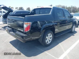 2006 Honda Ridgeline RTL with VIN 2HJYK16576H566002, listed as a IAAI auction lot 42595698 with 212,637 mi miles and . Bid and sale history available at DreamBid. Image 4.
