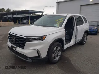 2023 Honda Pilot EX-L with VIN 5FNYG1H58PB016138, listed as a IAAI auction lot 40591717 with 10,068 mi miles and . Bid and sale history available at DreamBid. Image 2.