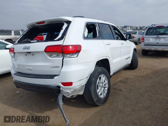 2020 Jeep Grand Cherokee Laredo E with VIN 1C4RJEAG4LC245884, listed as a IAAI auction lot 42564754 with 63,356 mi miles and . Bid and sale history available at DreamBid. Image 4.