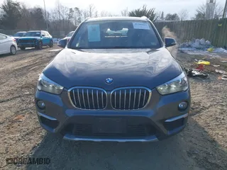 2018 BMW X1 xDrive28i with VIN WBXHT3C33J5F90349, listed as a IAAI auction lot 41385063 with 55,994 mi miles. Bid and sale history available at carsss.com. Image 13.