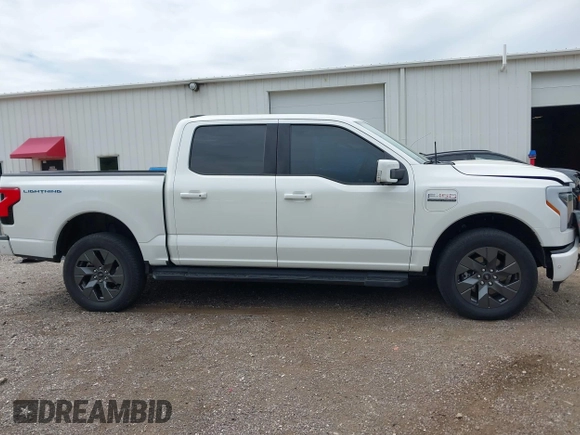 2022 Ford F-150 Lightning Pro with VIN 1FTVW1EL3NWG16132, listed as a IAAI auction lot 42362459 with 16,509 mi miles and . Bid and sale history available at DreamBid. Image 14.