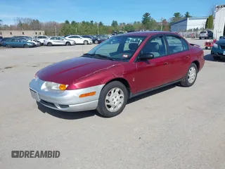 2000 Saturn SL z VIN 1G8ZK5274YZ241392, wystawiony jako IAAI lot #42168456 z przebiegiem 99 406 mil mil oraz . Historia ofert i sprzedaży dostępna na DreamBid. Obrazek 2.