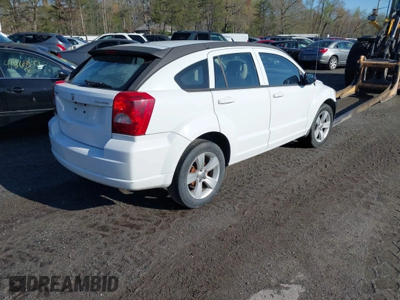 2011 Dodge Caliber Mainstreet with VIN 1B3CB3HA0BD113353, listed as a IAAI auction lot 41727663 with 116,633 mi miles and . Bid and sale history available at DreamBid. Image 4.