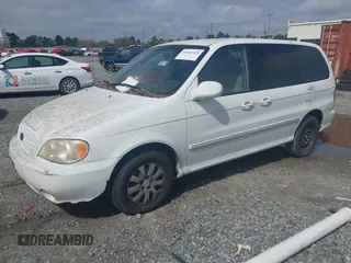 2005 Kia Sedona LX with VIN KNDUP132856700868, listed as a IAAI auction lot 41661428 with 229,142 mi miles. Bid and sale history available at carsss.com. Image 2.