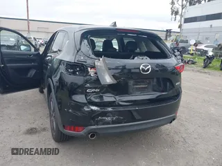 2018 Mazda CX-5 Grand Touring with VIN JM3KFADM4J0326760, listed as a IAAI auction lot 41885100 with 82,091 mi miles and . Bid and sale history available at DreamBid. Image 6.