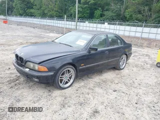 1997 BMW 5 Series 540i z VIN WBADE6326VBW50947, wystawiony jako IAAI lot #42407866 z przebiegiem 176 266 mil mil oraz . Historia ofert i sprzedaży dostępna na DreamBid. Obrazek 2.