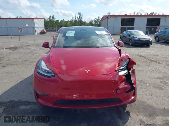 2023 Tesla Model Y Long Range with VIN 7SAYGDEE1PA154996, listed as a IAAI auction lot 41472595 with 24,861 mi miles and . Bid and sale history available at DreamBid. Image 12.