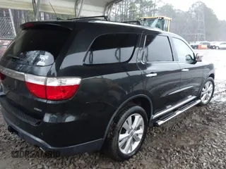 2013 Dodge Durango Crew with VIN 1C4SDJDT3DC509611, listed as a IAAI auction lot 41729805 with 161,357 mi miles. Bid and sale history available at carsss.com. Image 4.