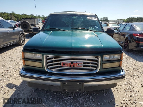 1999 GMC Yukon with VIN 1GKEC13R8XJ792078, listed as a Copart auction lot 50903294 with 232,672 mi miles and Salvage Title. Bid and sale history available at carsss.com. Image 5.