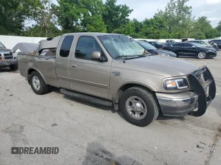 2002 Ford F-150 XL with VIN 1FTRX17L02KC02580, listed as a Copart auction lot 60859595 with 175,892 mi miles and Salvage title. Bid and sale history available at DreamBid. Image 4.