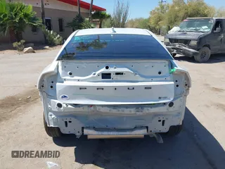 2024 Toyota Prius LE with VIN JTDACAAU5R3046244, listed as a IAAI auction lot 42464523 with 13,590 mi miles and . Bid and sale history available at DreamBid. Image 17.