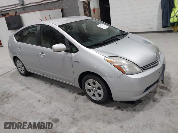 2007 Toyota Prius z VIN JTDKB20U977649489, wystawiony jako IAAI lot #41772600 z przebiegiem 248 525 mil mil oraz . Historia ofert i sprzedaży dostępna na DreamBid. Obrazek 1.