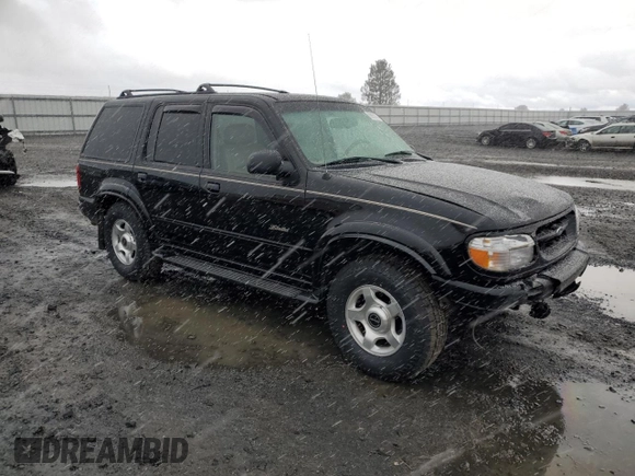 2000 Ford Explorer Limited with VIN 1FMDU75EXYZA76329, listed as a Copart auction lot 80952474 with 90,637 mi miles and Salvage title. Bid and sale history available at DreamBid. Image 4.