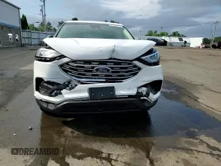 2019 Ford Edge SE z VIN 2FMPK4G94KBB24225, wystawiony jako Copart lot #61424715 z przebiegiem 73 324 mil mil oraz Szkoda całkowita • Salvage title. Historia ofert i sprzedaży dostępna na DreamBid. Obrazek 13.