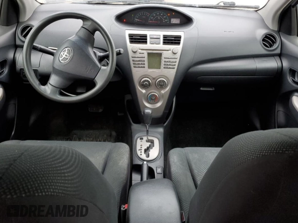 2010 Toyota Yaris with VIN JTDBT4K39A1380336, listed as a Copart auction lot 51855835 with 141,745 mi miles and Salvage Title. Bid and sale history available at DreamBid. Image 8.