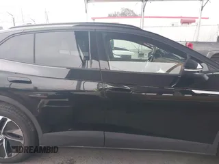 2021 Volkswagen ID.4 Pro S z VIN WVGTMPE26MP065481, wystawiony jako IAAI lot #41719800 z przebiegiem Nie podano mil oraz . Historia ofert i sprzedaży dostępna na DreamBid. Obrazek 14.