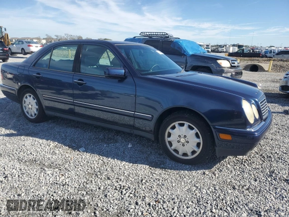 1998 Mercedes-Benz E-Class with VIN WDBJF65F3WA642006, listed as a Copart auction lot 87309994 with 129,837 mi miles and Salvage Title. Bid and sale history available at carsss.com. Image 4.