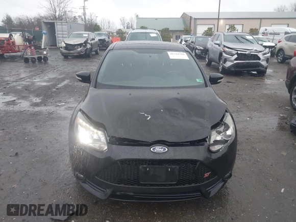 2014 Ford Focus ST with VIN 1FADP3L94EL180667, listed as a IAAI auction lot 41718746 with 141,574 mi miles and . Bid and sale history available at carsss.com. Image 12.