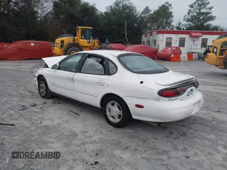 1999 Ford Taurus SE with VIN 1FAFP53S4XA185115, listed as a IAAI auction lot 41263216 with 182,770 mi miles. Bid and sale history available at carsss.com. Image 3.