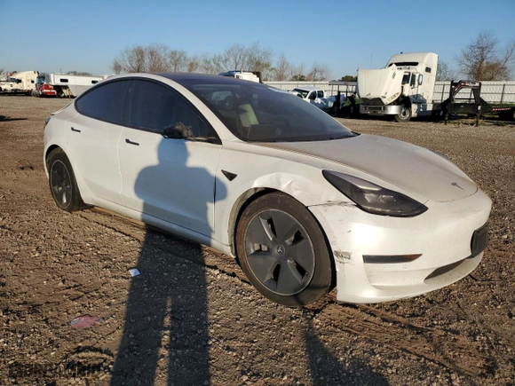 2021 Tesla Model 3 Standard Range Plus with VIN 5YJ3E1EA9MF100403, listed as a Copart auction lot 48561545 with 68,996 mi miles and Salvage Title. Bid and sale history available at carsss.com. Image 4.