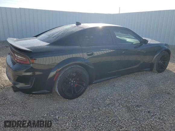 2021 Dodge Charger Scat Pack Widebody with VIN 2C3CDXGJ5MH637464, listed as a Copart auction lot 85671524 with 101,343 mi miles and Salvage Title. Bid and sale history available at carsss.com. Image 3.