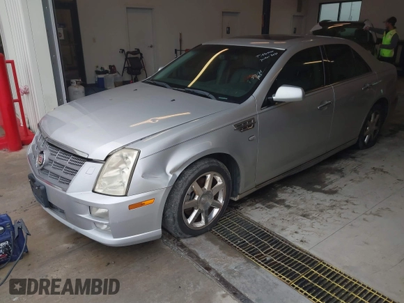 2011 Cadillac STS RWD with VIN 1G6DW6ED4B0120517, listed as a IAAI auction lot 41765069 with 120,059 mi miles and . Bid and sale history available at DreamBid. Image 2.