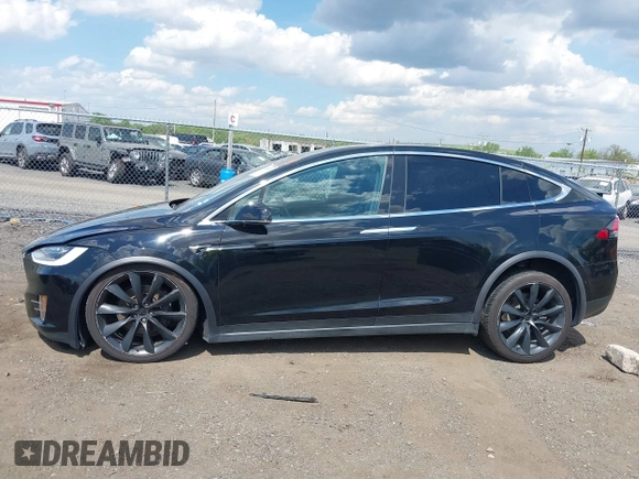 2019 Tesla Model X 75D with VIN 5YJXCBE21KF180203, listed as a IAAI auction lot 42190255 with 114,294 mi miles and . Bid and sale history available at DreamBid. Image 14.