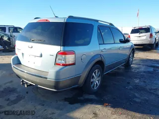 2008 Ford Taurus X SEL with VIN 1FMDK02W58GA33572, listed as a IAAI auction lot 41386299 with 174,484 mi miles. Bid and sale history available at carsss.com. Image 4.