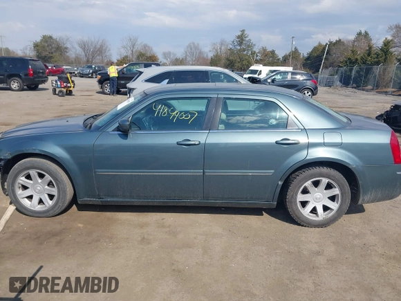 2005 Chrysler 300 with VIN 2C3JA53G35H157178, listed as a IAAI auction lot 41849007 with 149,247 mi miles. Bid and sale history available at carsss.com. Image 13.